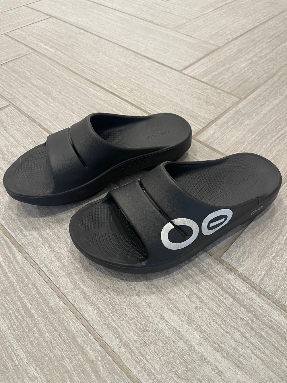 OOFOS Black Slide Sandals with White Accent Logo